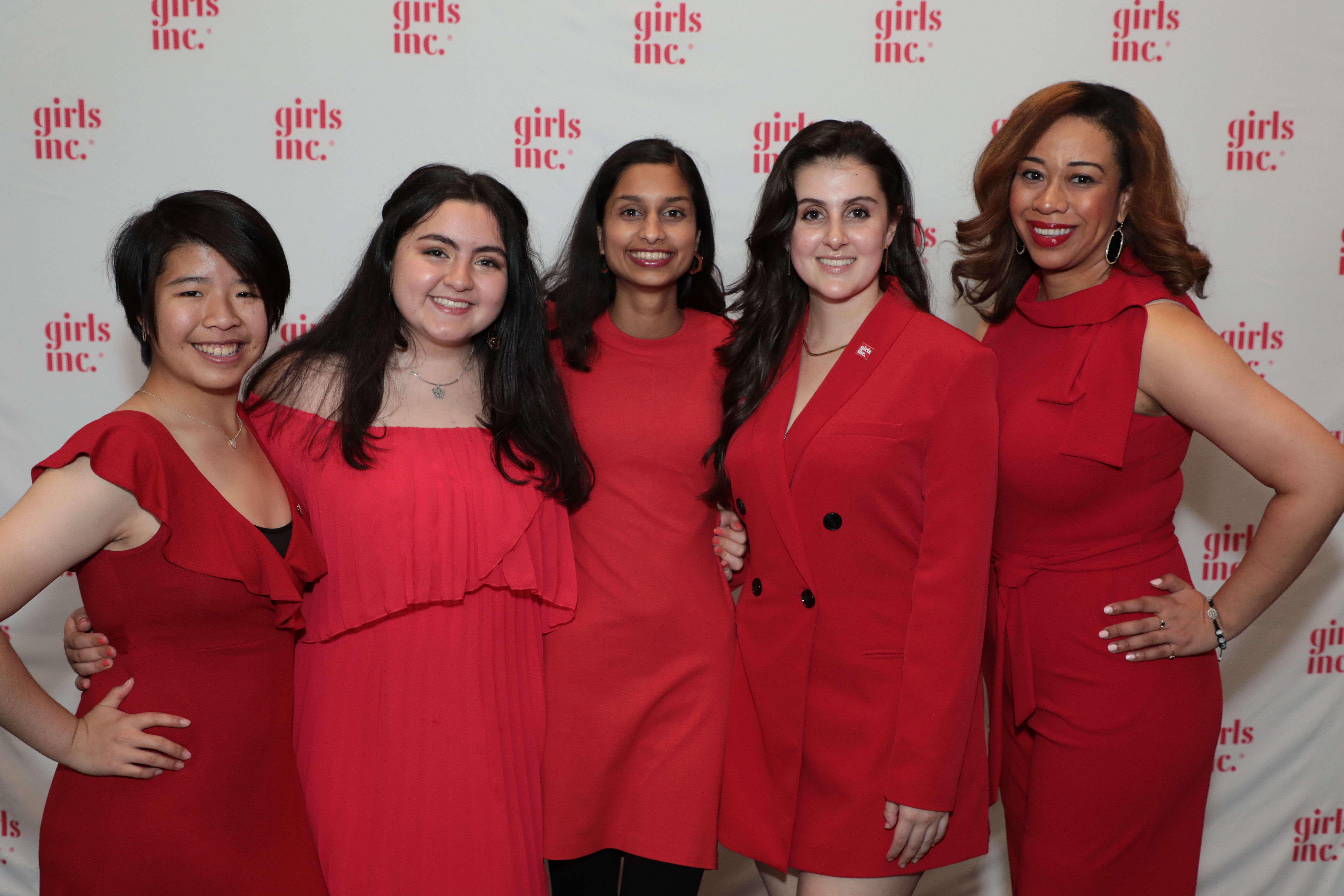 5 women in red dresses at the Girls Inc. 2019 Luncheon